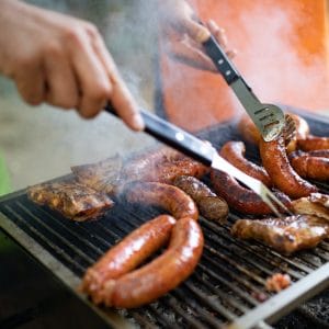 Delicious sausages on the barbecue grill outdoor